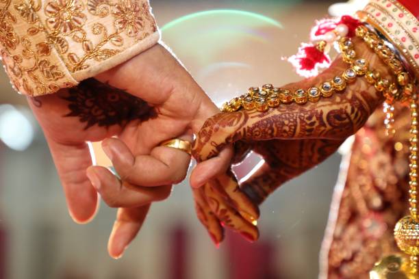 Couple's fingers clasped